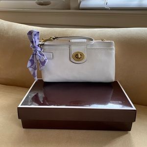 PREOWNED Coach white wristlet.